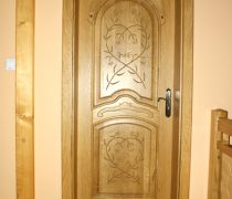 Drzwi wewnętrzne dębowe, rzeźbione w stylu góralskim